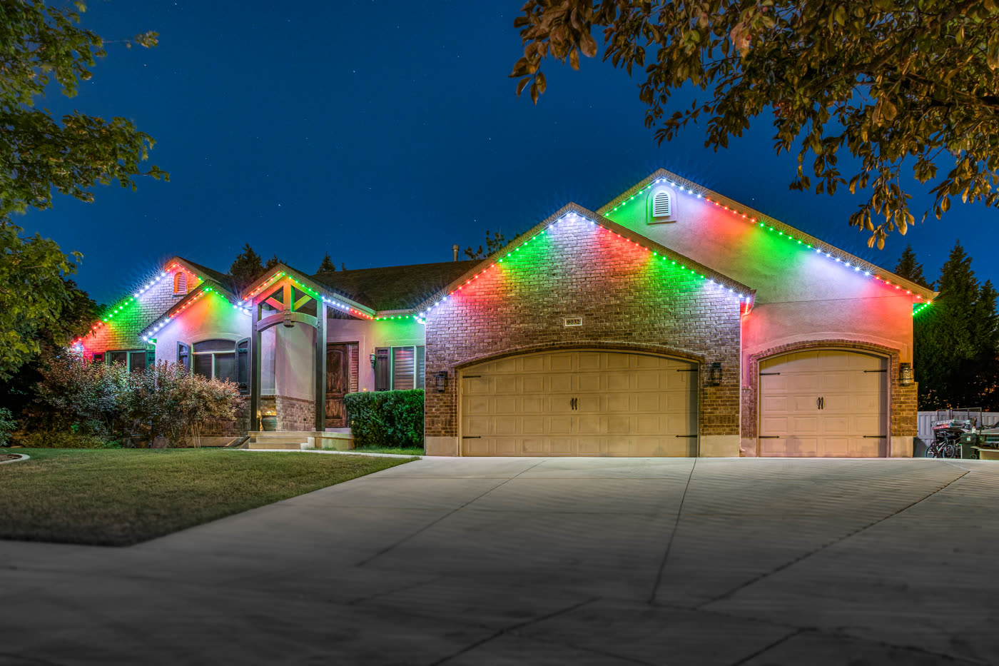 Home with Trimlight lighting at night